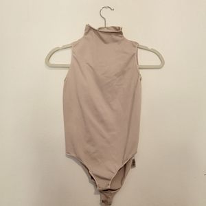 Skims sleeveless high neck bodysuit never been used